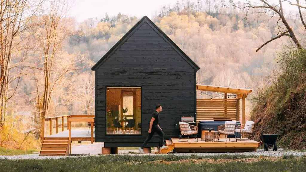 Black Stained Exterior with Large Windows and Deck Spaces